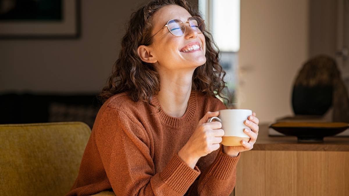 A woman enjoying a cup of coffee